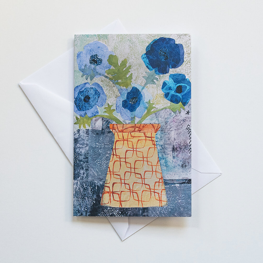 botanical greeting notecard of blue poppies bouquet with white envelope and blank inside